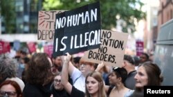 Protestors demonstrate outside the Home Office against the British Governments plans to deport asylum seekers to Rwanda, in London, Britain, June 13, 2022. 