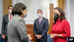 In this photo released by the Taiwan Presidential Office, Taiwan's President Tsai Ing-wen, left, meets with United States Congressional member Florida Democrat Stephanie Murphy, who led a delegation to Taipei, Taiwan, Sept. 8, 2022.