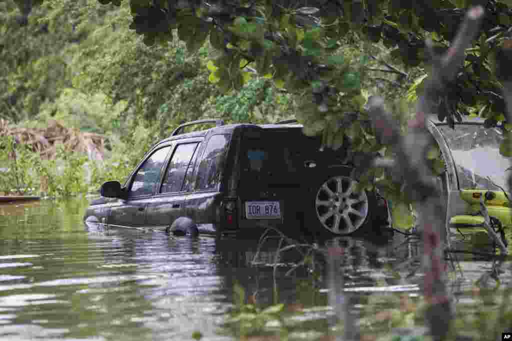 A vehicle is submerged after Hurricane Fiona in Salinas, Puerto Rico, Sept. 19, 2022.