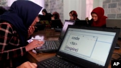 Young female Afghan coders practice at a Code to Inspire computer training center in Herat province, western Afghanistan, Jan. 21, 2018. The NGO had to renew its registration under the new Taliban regime to reopen the school.