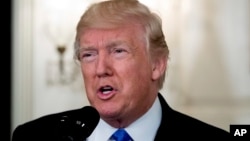 FILE - President Donald Trump speaks in the Diplomatic Room of the White House in Washington, June 14, 2017, about the shooting in Alexandria, Va. where House Majority Whip Steve Scalise of La., and others, where shot.