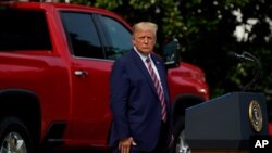 President Donald Trump pauses as he speaks during an event on regulatory reform on the South Lawn of the White House, July 16, 2020, in Washington. 