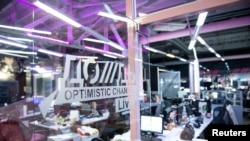 FILE - The logo of TV Dozhd (Rain) online news channel is seen in a studio in Moscow, Russia, Aug. 20, 2021. The channel was forced to suspend operations in Russia in March, not even two weeks after the start of Russia's invasion of Ukraine.