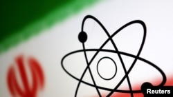 FILE - The atom symbol and the Iranian flag are seen in this photo illustration created July 21, 2022.
