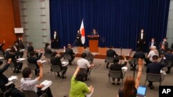 Japan's Prime Minister Fumio Kishida, center, delivers a speech at his official residence in Tokyo, July 14, 2022. Kishida blamed inadequate police security for the death of former leader Shinzo Abe, who was shot while giving an outdoor campaign speech.