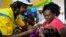 FILE - A health worker vaccinates a child against malaria in Homabay County, western Kenya.