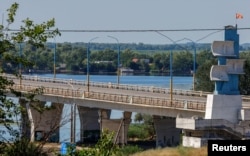 The Antonivskyi bridge is closed to civilians after it reportedly came under fire during the Ukraine-Russia conflict in the Russian-controlled city of Kherson, Ukraine, July 27, 2022.