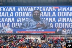 Supporters sit in the stands during Kenyan presidential candidate Raila Odinga's final election campaign rally at Kasarani stadium, in Nairobi, Kenya, Aug. 6, 2022.