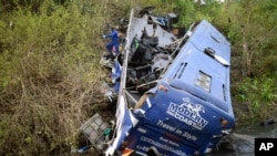 A view of the wreckage of a bus that plunged into Nithi bridge on Sunday, in Tharaka Nithi county Meru, Kenya, July 25, 2022. 