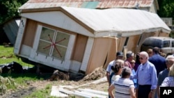 President Joe Biden tours a neighborhood impacted by flooding, in Lost Creek, Kentucky, Aug. 8, 2022. 