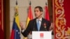 FILE - The leader of Venezuela's political opposition Juan Guaido makes a speech at the Madrid regional government building during a visit to Madrid, Spain, Jan. 25, 2020. 