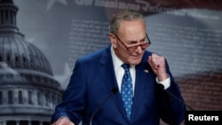 US Senate Majority Leader Chuck Schumer (D-NY) speaks to the media after the 51-50 vote passed the 'Inflation Reduction Act of 2022' on Capitol Hill in Washington, Aug. 7, 2022. 