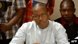 FILE - Journalist Newton Ahmed Barry is seen at a press conference in Ouagadougou, Burkina Faso, July 25, 2016.