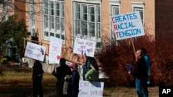 People protesting critical race theory in schools, Friday, Nov. 12, 2021, in Albuquerque, New Mexico.