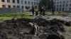 A sapper works at a compound of the National Academy of Urban Economy damaged by a Russian military strike, as Russia's attack on Ukraine continues, in Kharkiv, Ukraine July 23, 2022. 