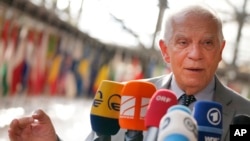 FILE - European Union foreign policy chief Josep Borrell speaks with the media as he arrives for a meeting of EU foreign ministers in Brussels on Monday, July 18, 2022. 