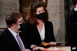 FILE - Senate Parliamentarian Elizabeth MacDonough listens in the House chamber at the Capitol in Washington, Jan. 6, 2021.