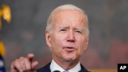 FILE - President Joe Biden speaks about the Inflation Reduction Act of 2022 in the State Dining Room of the White House in Washington, July 28, 2022. 