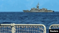 A Taiwan military vessel is seen from a Navy Force vessel under the Eastern Theatre Command of China's People's Liberation Army during the navy's military exercises in the waters around Taiwan, in this Aug. 5, 2022 handout. (Eastern Theatre Command/Handout via Reuters) 