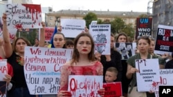 Protesters attend a rally in support of Ukrainian soldiers from the Azov Regiment who were captured by Russia in May after the fall of Mariupol, in Kyiv, Ukraine, Aug. 4, 2022.