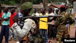 FILE - A Chad soldier holds his weapon in Bangui, Central African Republic, Dec. 9. 2013.