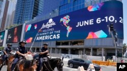 FILE - Police officers on horseback patrol in preparation for the Summit of the Americas, Monday, June 6, 2022, in Los Angeles. 