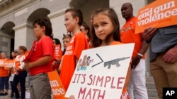 Elise Schering, 7, takes part in a National Gun Violence Awareness rally at the Capitol in Sacramento, Calif., June 2, 2022.