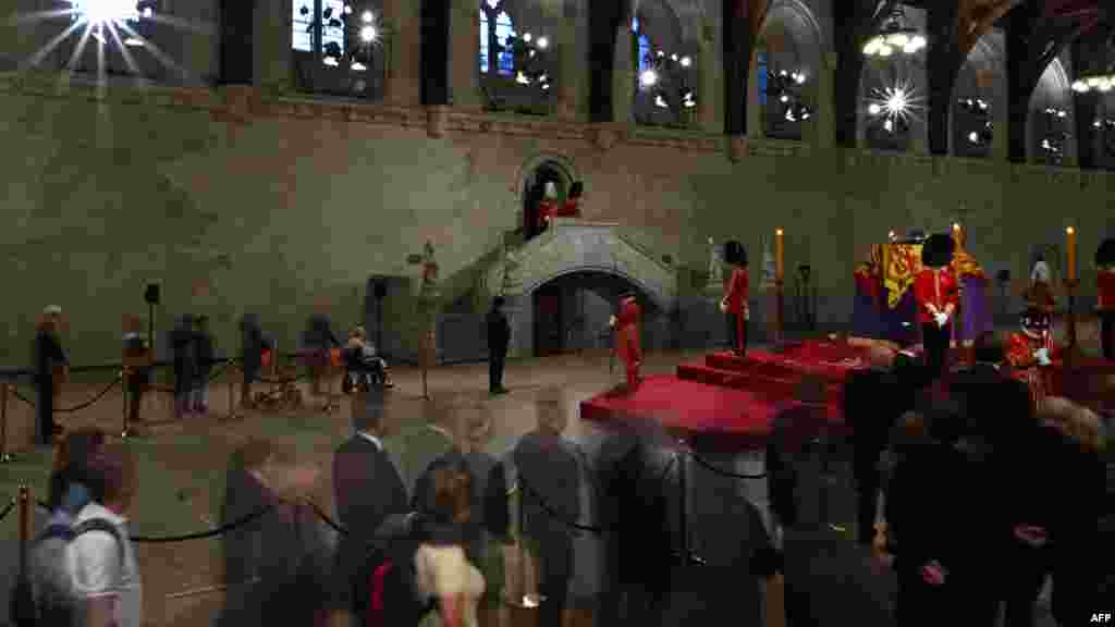 Members of the public file past the coffin of Queen Elizabeth II at Westminster Hall, in London, Sept. 14, 2022.