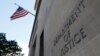 FILE - Signage is seen at the United States Department of Justice headquarters in Washington, Aug. 29, 2020. 