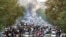 FILE - Protesters chant slogans during a protest over the death of a woman who was detained by the morality police, in downtown Tehran, Iran, Sept. 21, 2022, in this photo taken by an individual not employed by the Associated Press and obtained by the AP 