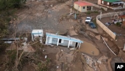 A house lays in the mud after it was washed away by Hurricane Fiona at Villa Esperanza in Salinas, Puerto Rico, Wednesday, Sept. 21, 2022. 