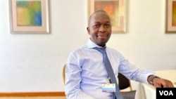 Griffins Ochieng, executive director of the Center for Environmental Justice and Development, poses for a photo at the African Ministerial Conference on the Environment, Sept. 12, 2022, in Dakar. (Annika Hammerschlag/VOA)