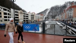 People walk at the Rosa Khutor Alpine Resort in Krasnaya Polyana near Sochi, Jan. 26, 2014. 