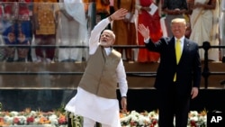FILE - U.S. President Donald Trump and Indian Prime Minister Narendra Modi wave to the crowd at Sardar Patel Stadium in Ahmedabad, India, Feb. 24, 2020.