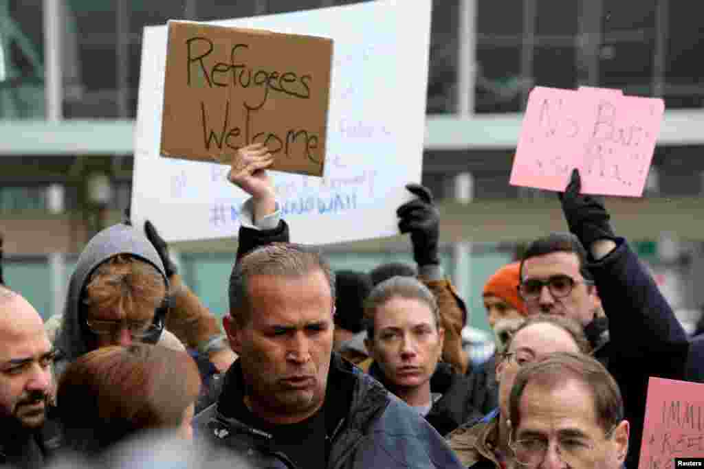 Iraqi immigrant Hameed Darwish addresses the media after being released from Terminal 4 at John F. Kennedy International Airport during the Donald Trump travel ban in Queens, New York, Jan. 28, 2017. 