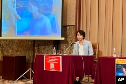 FILE - Images of Toru Kubota, a Japanese journalist detained in Myanmar while covering a protest, are displayed at the Japan Press Club in Tokyo on Aug. 3, 2022.