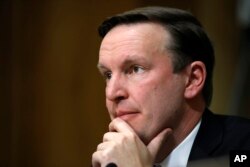 Sen. Chris Murphy, D-Conn., listens to testimony on Capitol Hill in Washington, April 12, 2018.