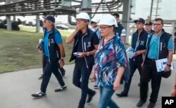 In this handout photo taken from video released by Russian Defense Ministry Press Service on Sept. 2, 2022, International Atomic Energy Agency (IAEA) director Rafael Grossi, center, and IAEA members inspect the Zaporizhzhia nuclear power plant in Enerhodar, southeastern Ukraine, Sept. 1, 2022.