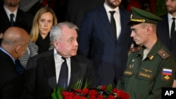 US ambassador to Russia John Joseph Sullivan, centre, walks to the coffin of former Soviet President Mikhail Gorbachev inside the Pillar Hall of the House of the Unions during a farewell ceremony in Moscow, Russia, Sept. 3, 2022.