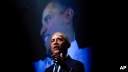 FILE - Former US President Barack Obama speaks during a memorial service for former Senate Majority Leader Harry Reid at the Smith Center in Las Vegas, Jan. 8, 2022.