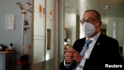 FILE - World Health Organization's Regional Director for Europe Hans Kluge gives an interview for Reuters in Brussels, Belgium, Dec. 22, 2021. 