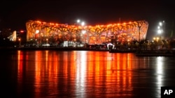 The Olympic Stadium is lit prior to the opening ceremony of the 2022 Winter Olympics, Feb. 4, 2022, in Beijing.