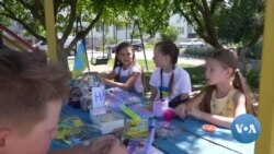 Ukrainian Children Sell Jewelry to Help Motherland