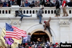 FILE - A mob of supporters of then-U.S. President Donald Trump storm the U.S. Capitol building in Washington, Jan. 6, 2021.