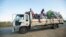 FILE - Displaced families from the community of Impire in the Cabo Delgado province travel on a flatbed truck as they flee on June 14, 2022, from armed insurgents who attacked their community two days earlier. 