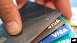 FILE - Visa credit cards are seen Aug. 11, 2019, in New Orleans.