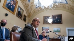 Chairman Bennie Thompson, D-Miss., and Vice Chair Liz Cheney, R-Wyo., of the House panel investigating the Jan. 6 U.S. Capitol insurrection, testify before the House Rules Committee at the Capitol in Washington, Dec. 14, 2021. 
