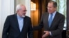 FILE - Iranian Foreign Minister Mohammad Javad Zarif, left, and Russian Foreign Minister Sergey Lavrov enter a hall for their talks in Moscow, Russia, Aug. 29, 2014.