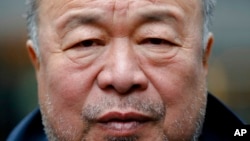 FILE - Chinese contemporary artist and activist Ai Weiwei poses for a portrait prior to a news conference in Berlin, Sept. 2, 2020.