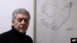 Yossi Beilin, a former senior Israeli official and peace negotiator who co-founded the Geneva Initiative, poses for a photo at his house in Tel Aviv, Israel, Feb. 6, 2022.